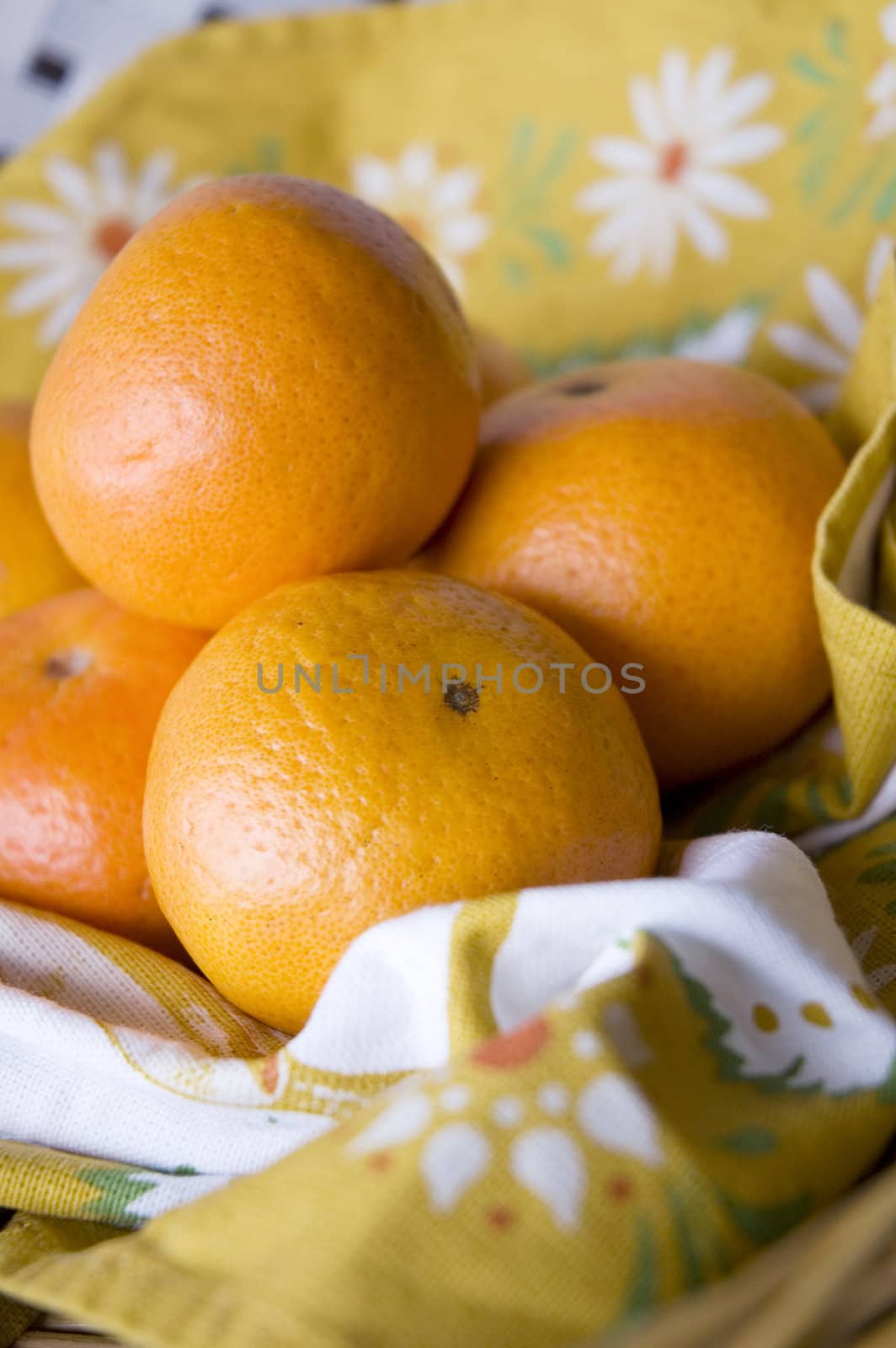 fresh oranges put on floral napkin