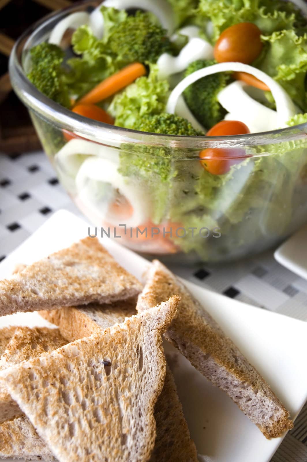 Healthy food green salad with wheat toasts