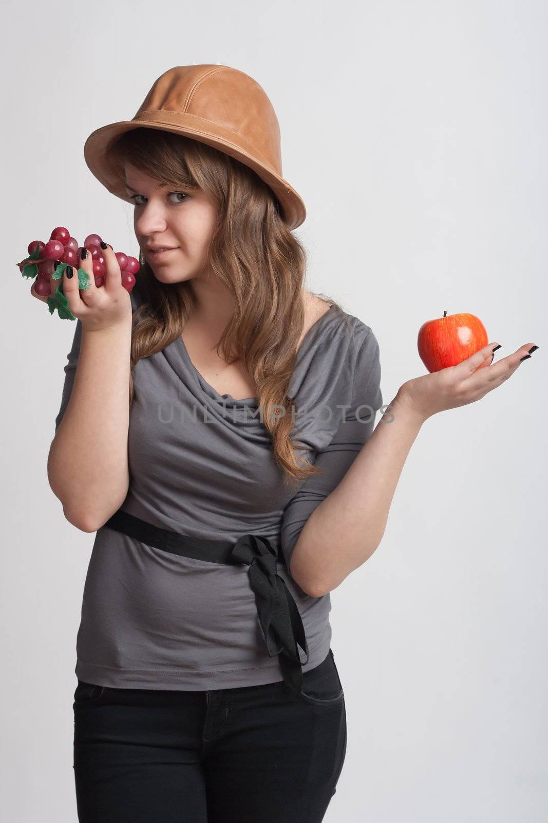 girl with grapes and apples in the hands of by victosha