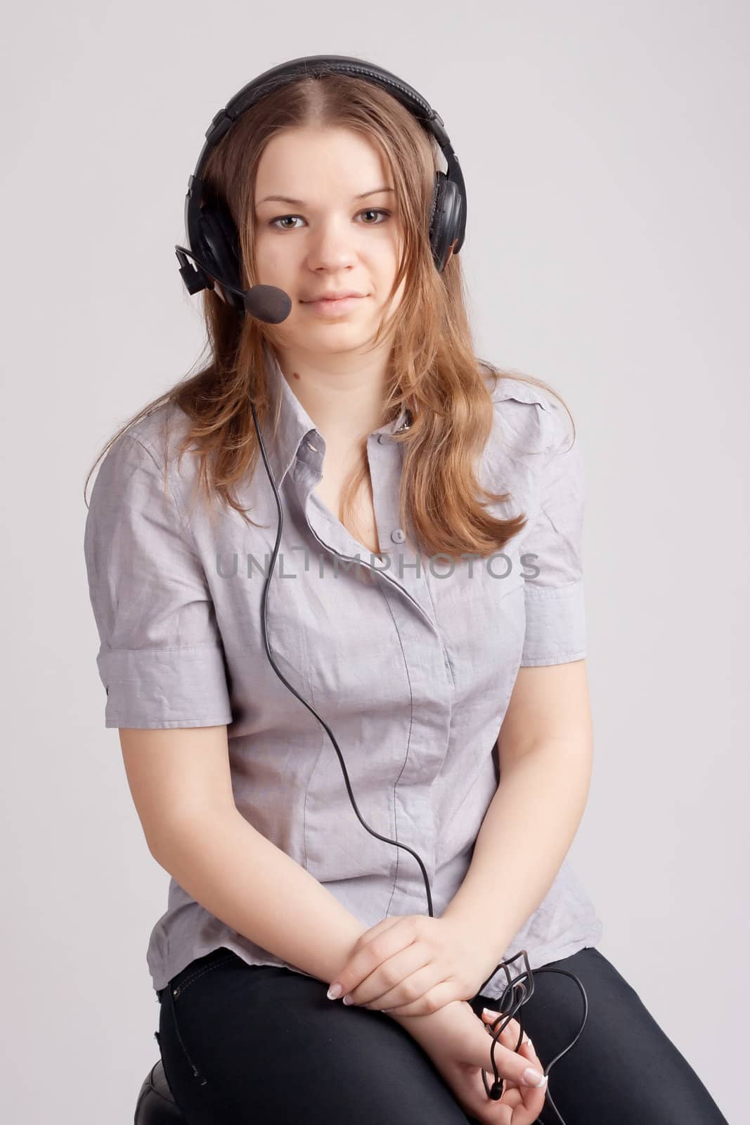 The girl in headphones with microphone
