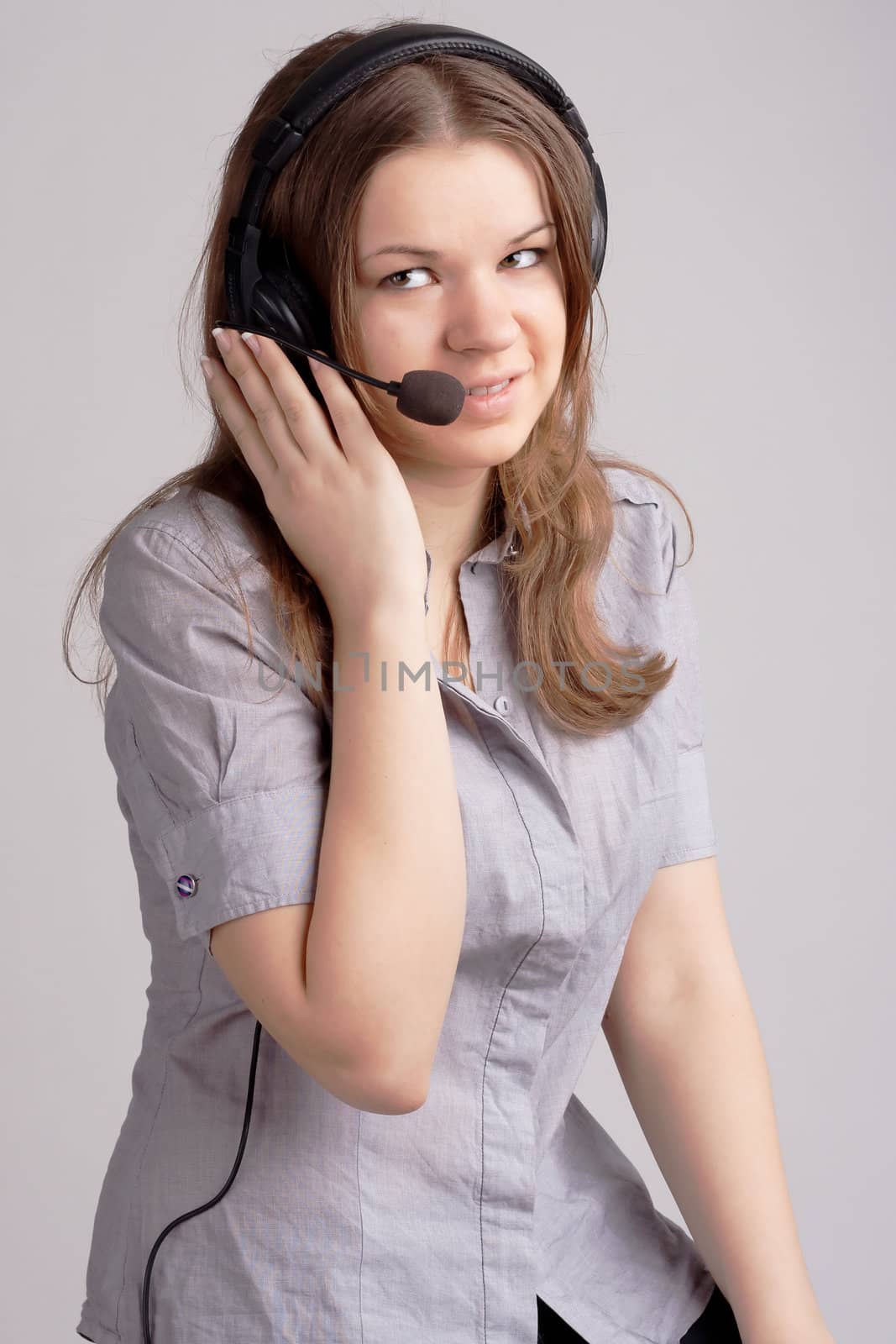 The girl in headphones with microphone