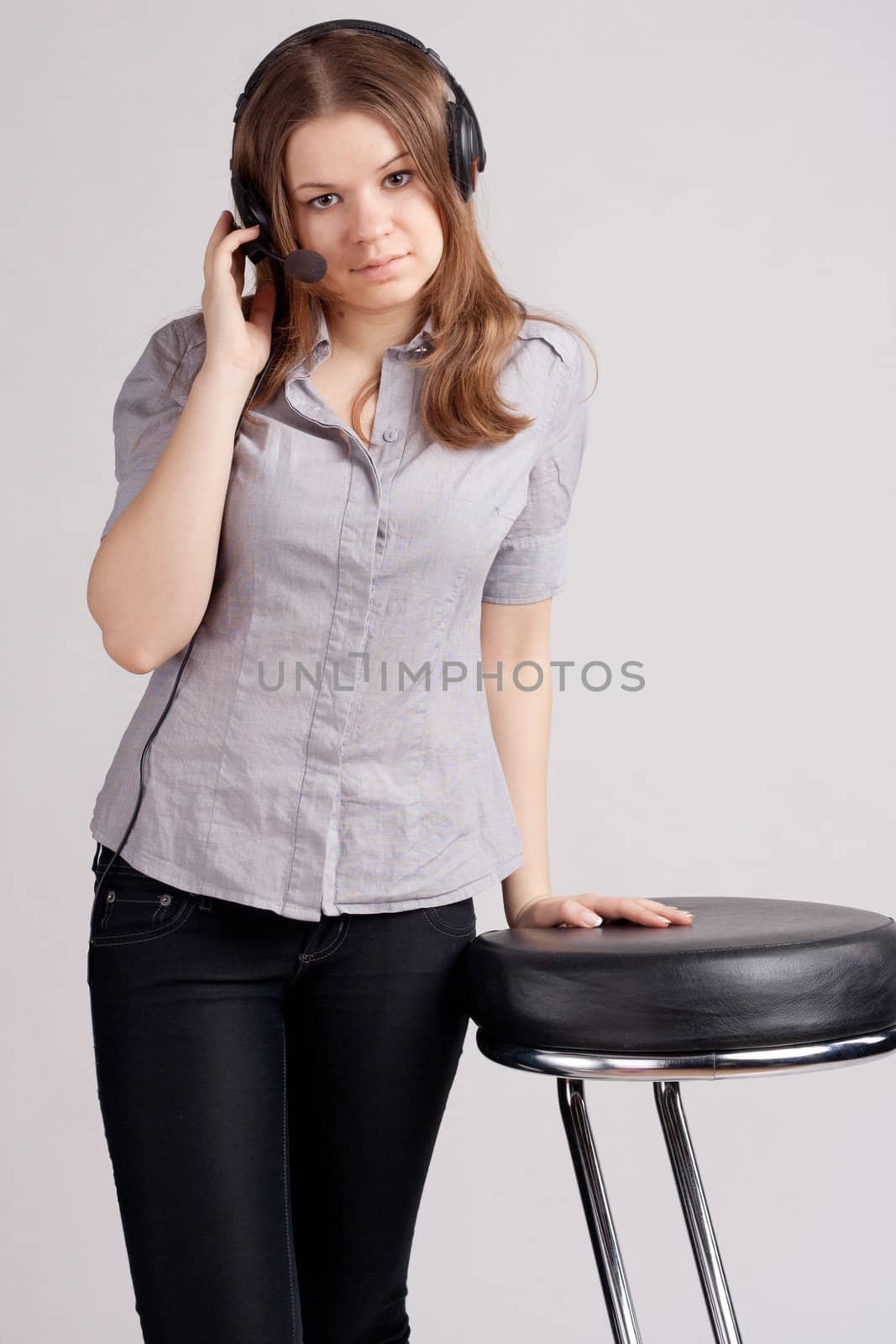 The girl in headphones with microphone