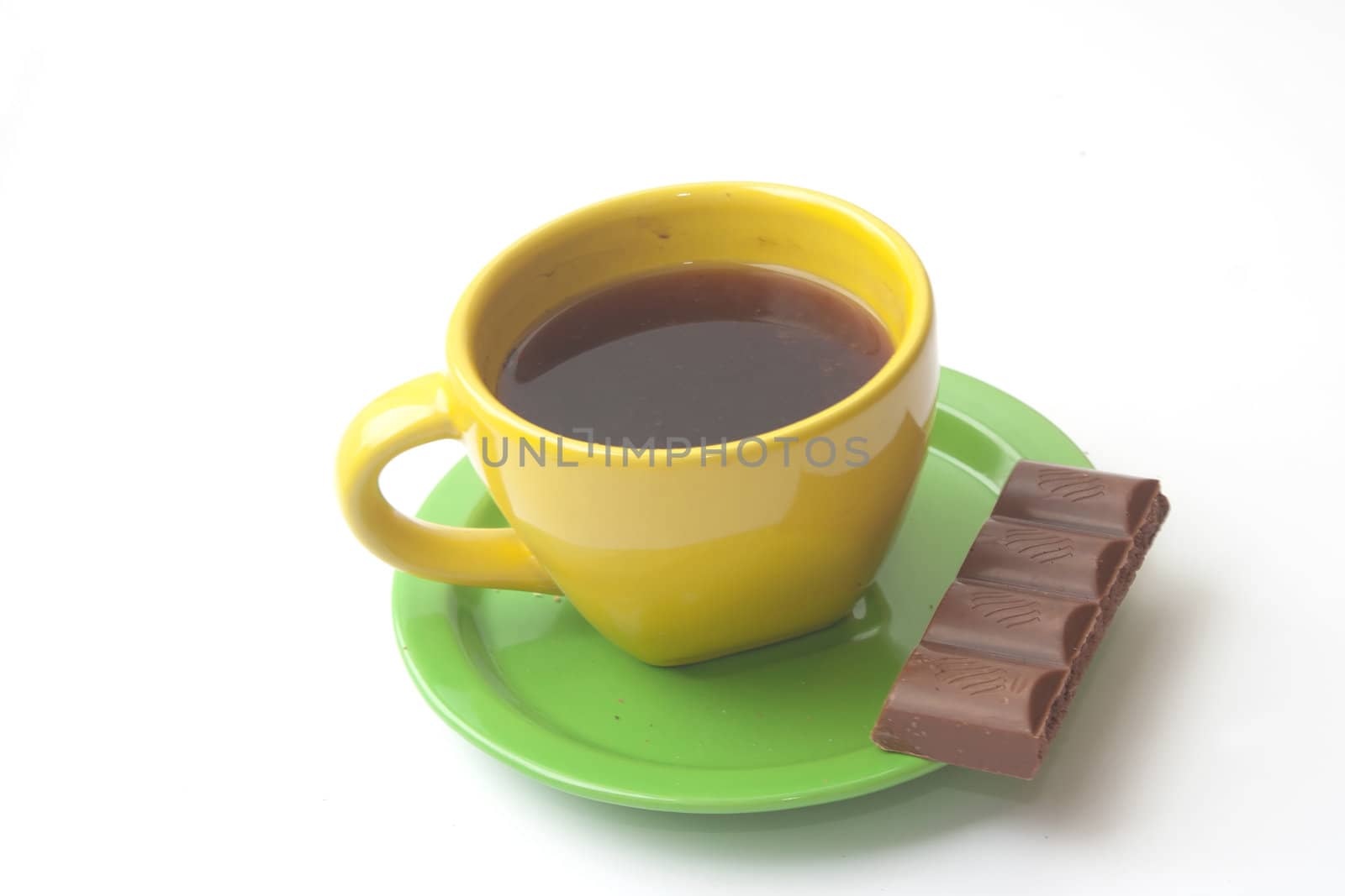 yellow cup of coffee with chocolate on a white background