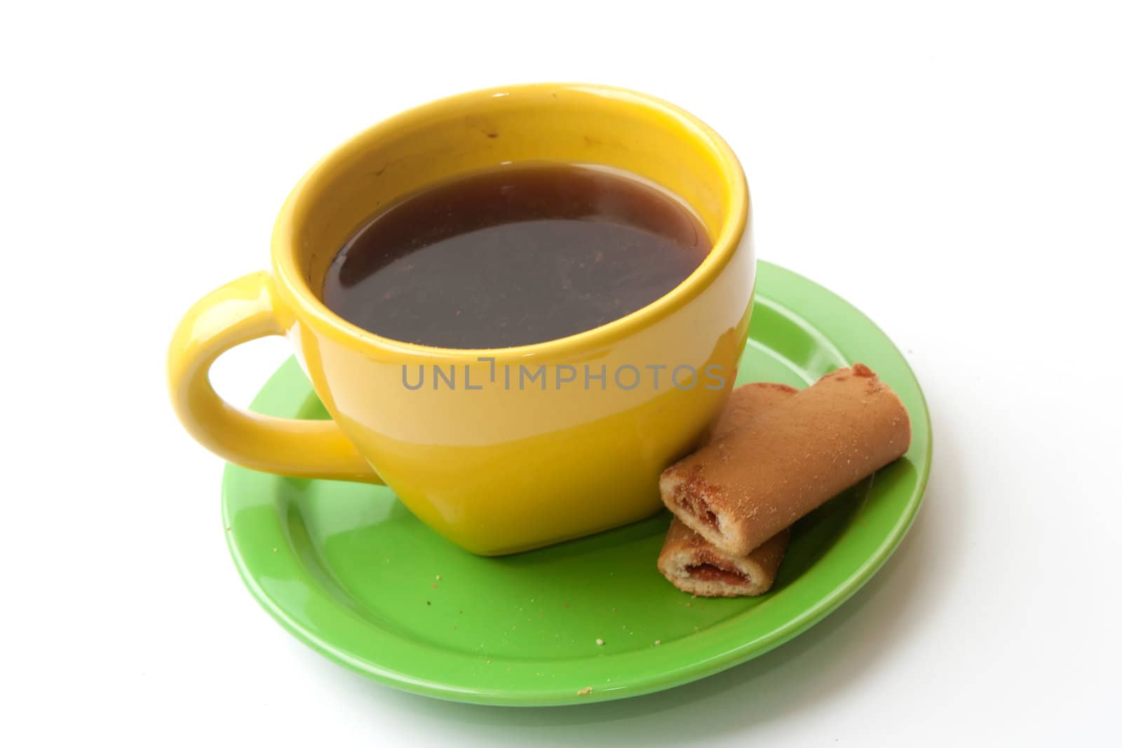 yellow cup of coffee with biscuits on a white background