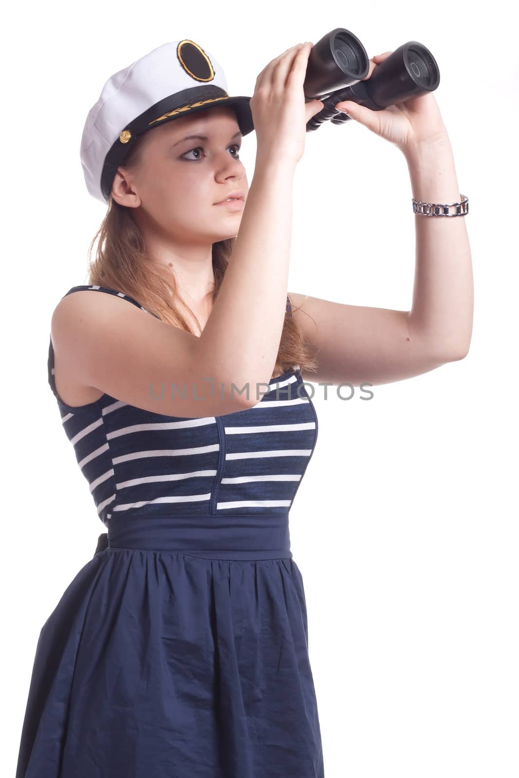A girl in a sailor cap looks through binoculars on a white background