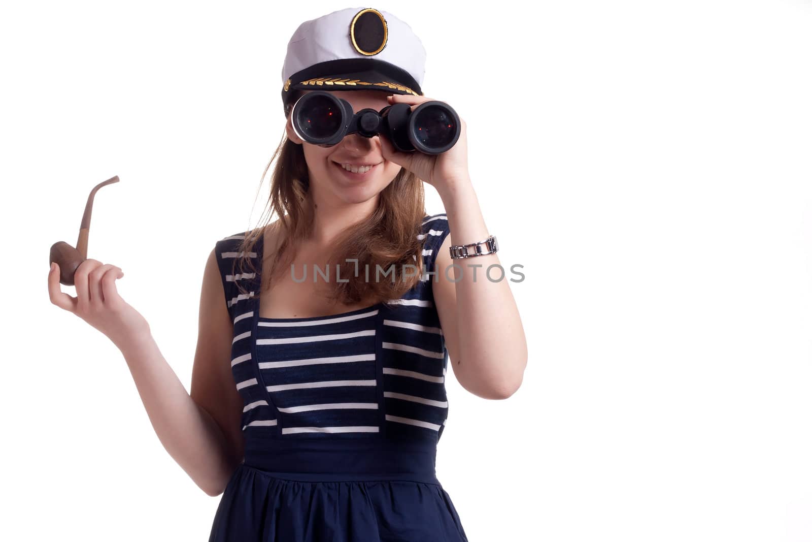 A girl in a sailor cap holding a pipe for smoking and looking through binoculars on a white background