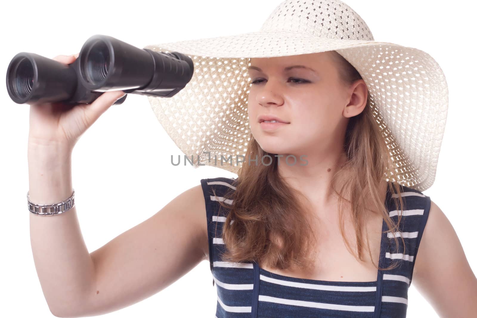 A girl in a big straw hat looking through binoculars on a white background