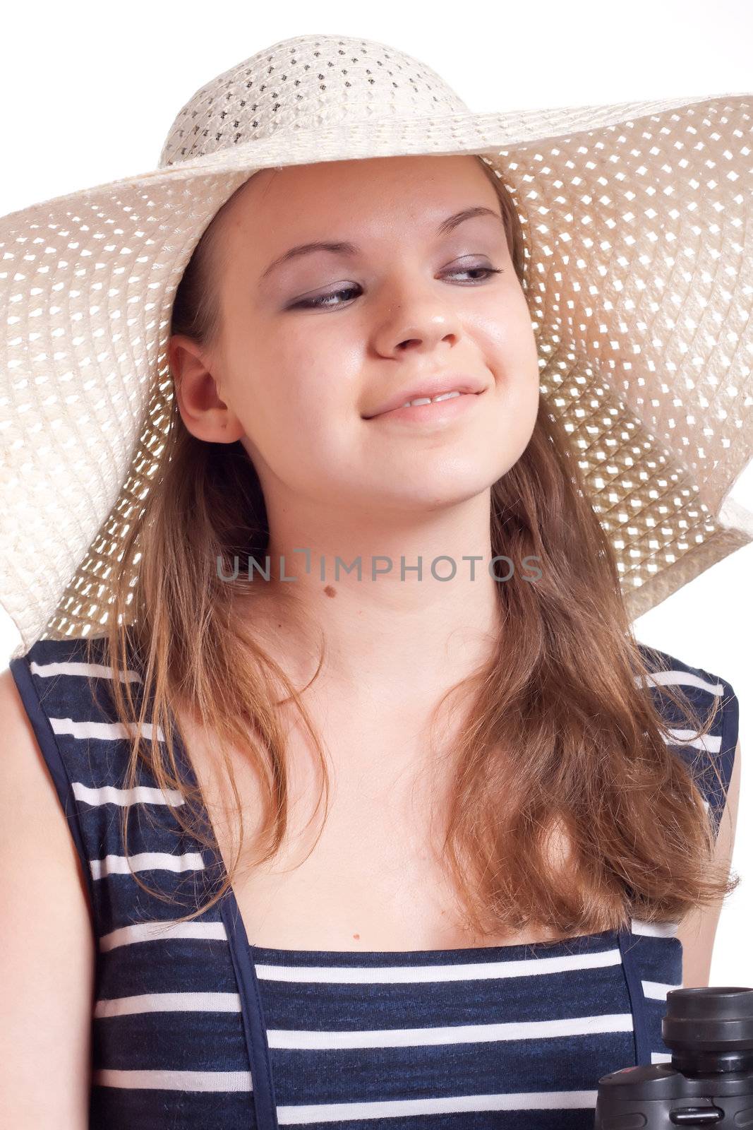 A girl in a big straw hat on a white background