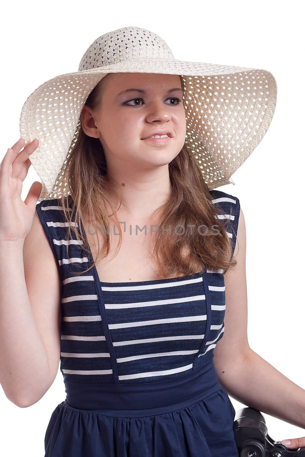A girl in a straw hat, studio shot
