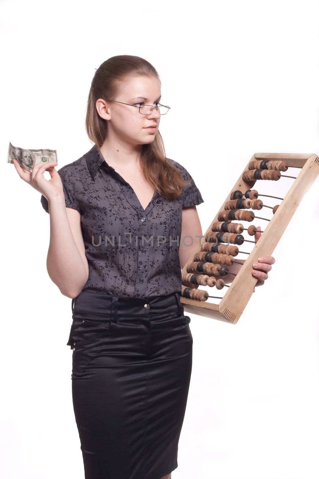 Girl with big wooden accounts and money on a white background