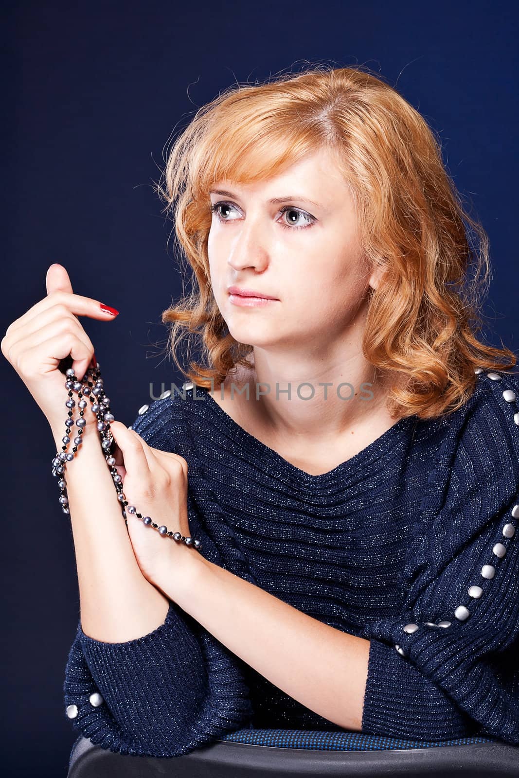 Beautiful girl with tied hands studio photography