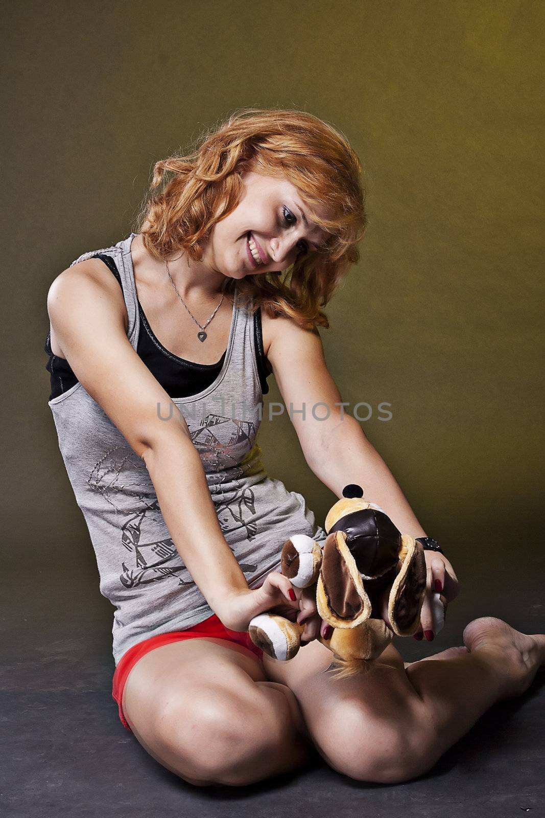 Redhead girl with a soft toy  by victosha