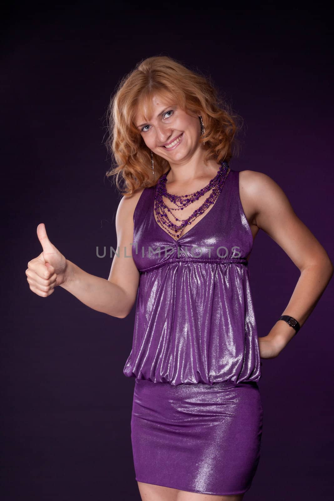 Girl in purple dress shows her thumb by victosha