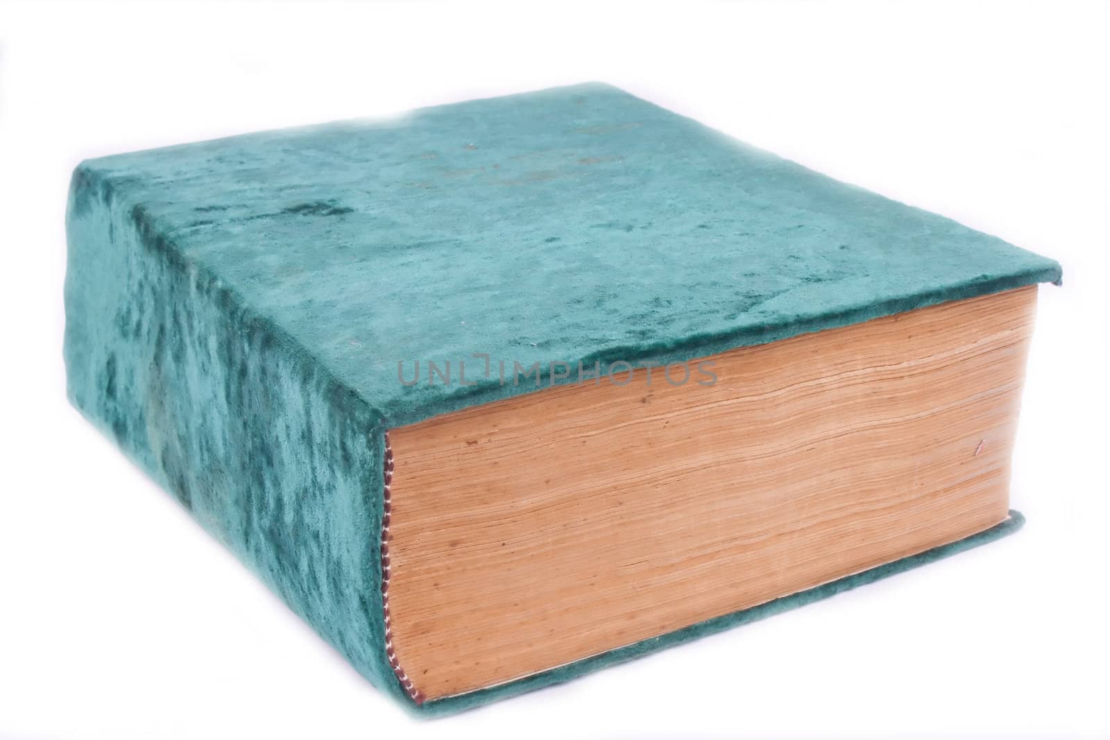 an old book in a green velvet with a white background