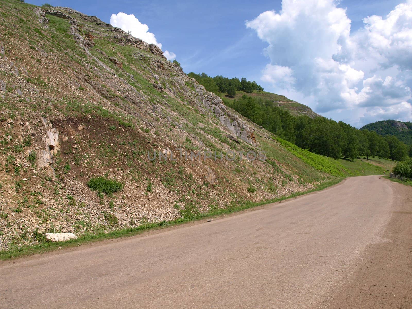 Summer landscape with road and hill