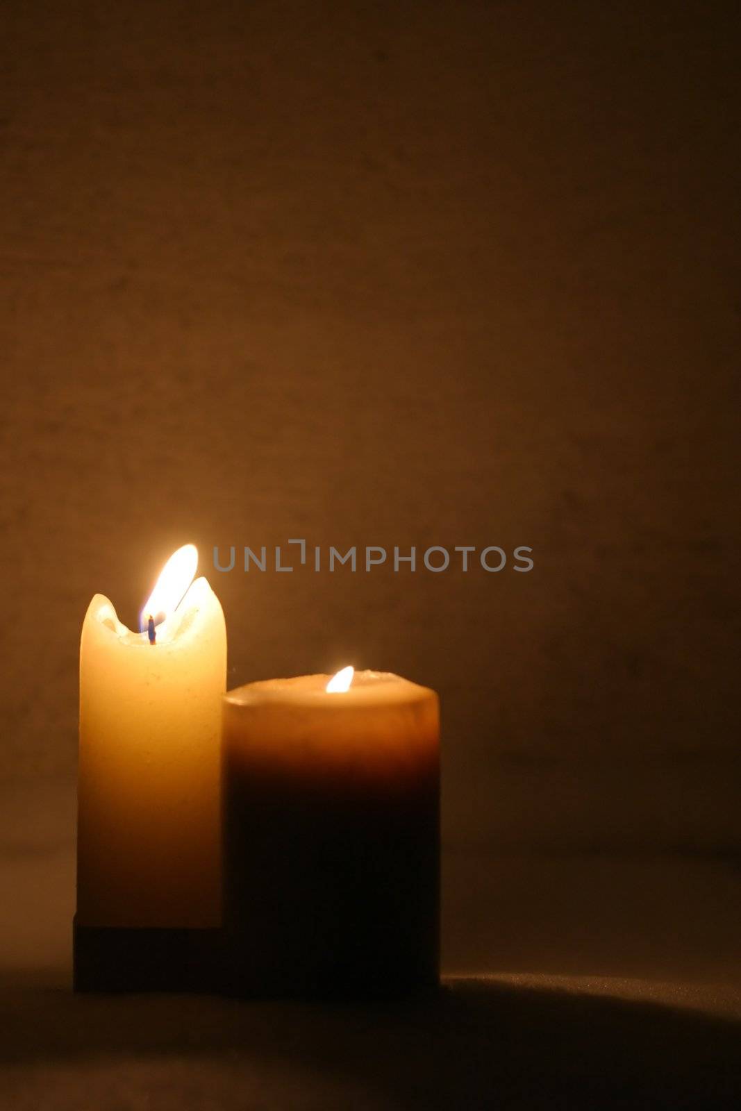Closeup of burning candles by yucas