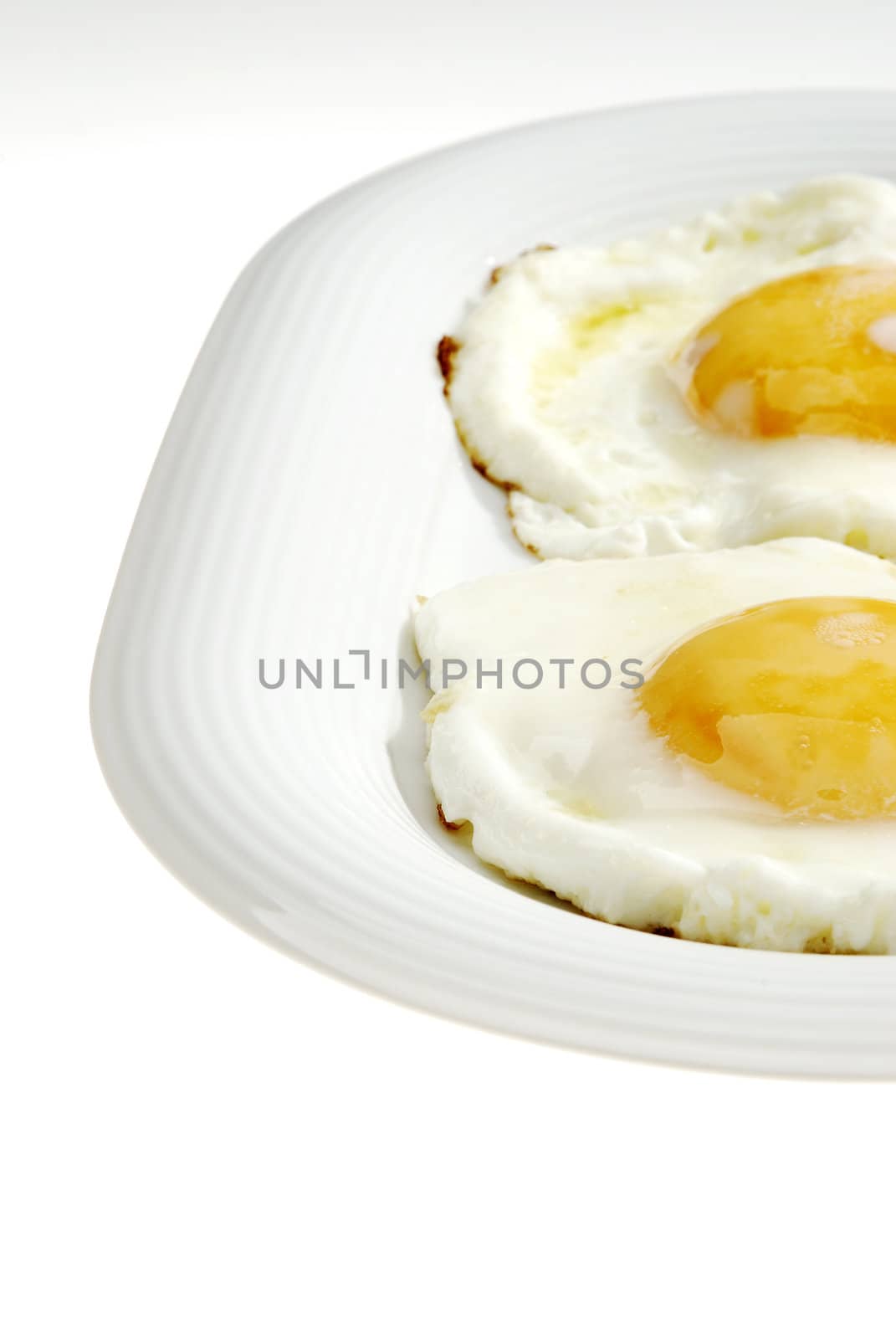 A pair of eggs on the plate