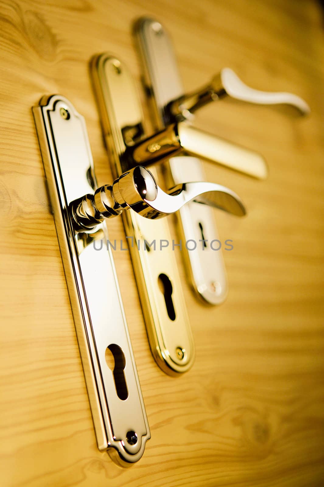 A series of golden handls on a wooden board 2