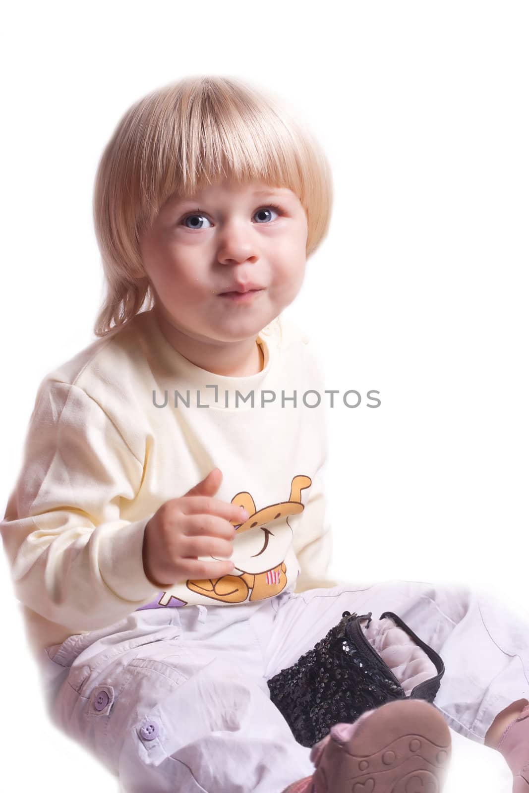 Small girl eating cookies on a white background