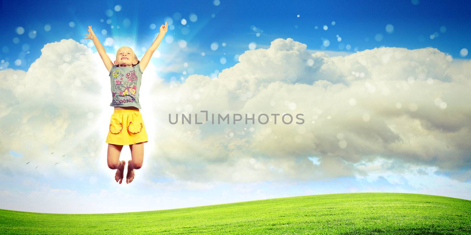 Photo of little girl jumping and raising hands against nature background