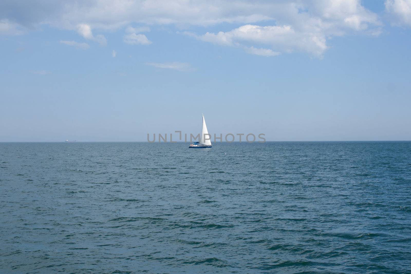 Lonely sailboat at sea by victosha