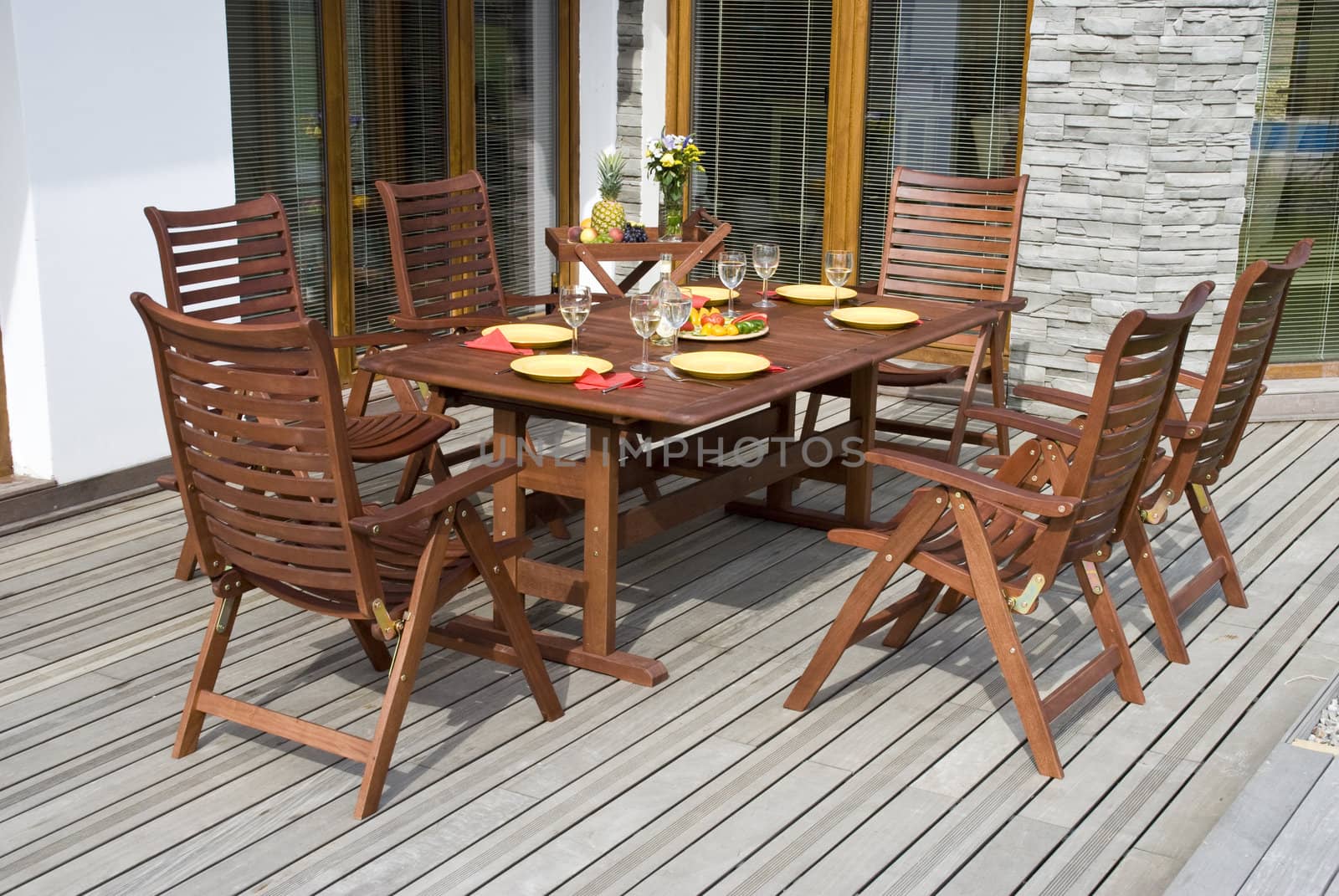 The Garden furniture by the house patio and with place setting