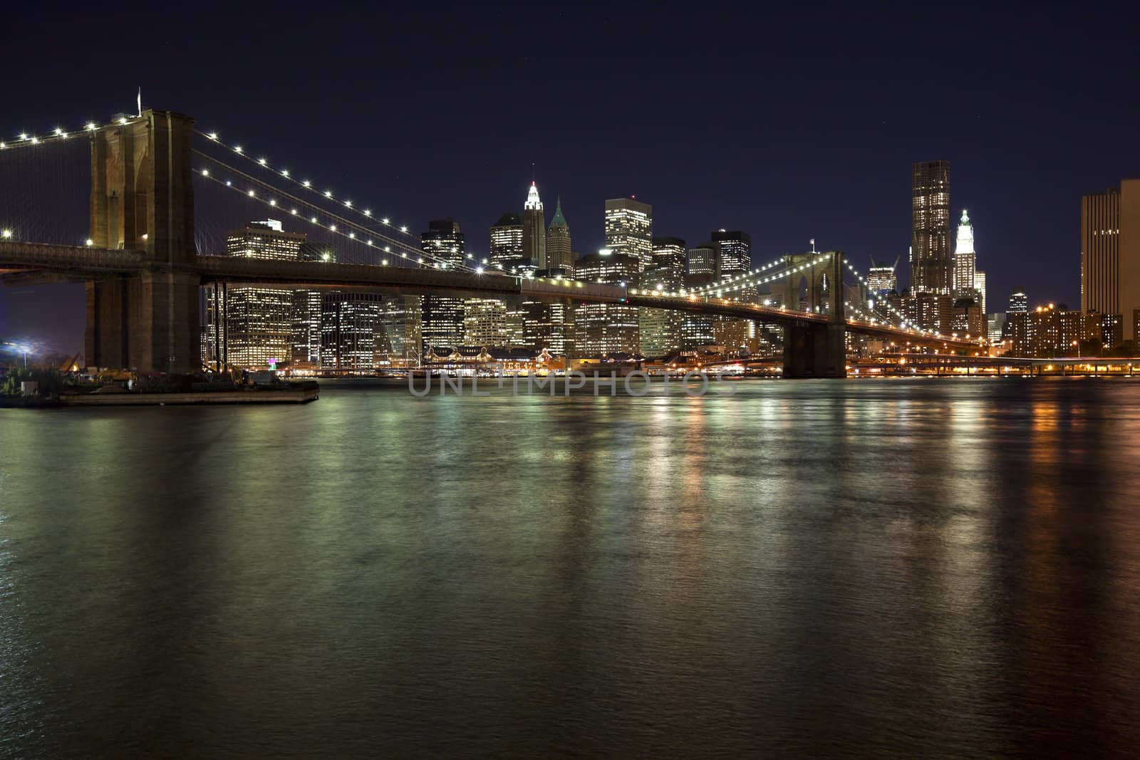 The New York City skyline w Brooklyn Bridge by hanusst