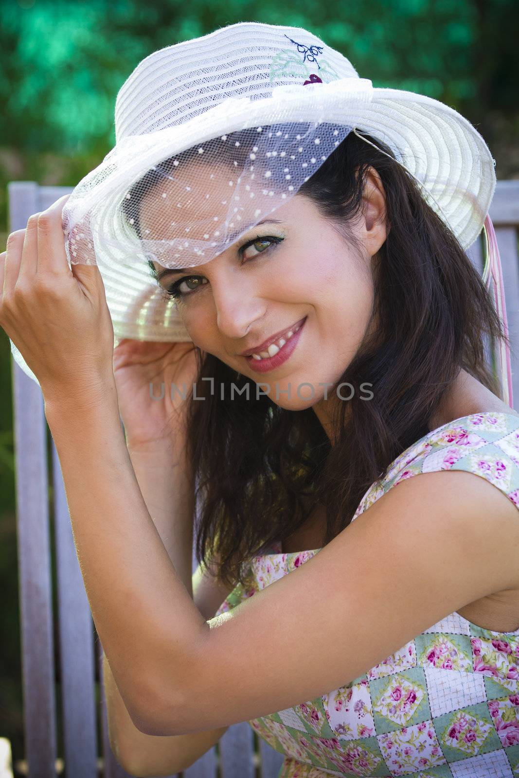 beautiful young brunette in a summer garden with white hat by FernandoCortes