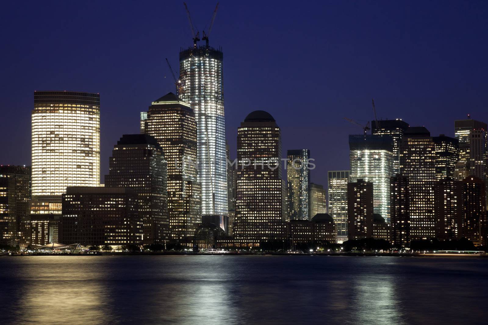 The New York City skyline at twilight w the Freedom tower