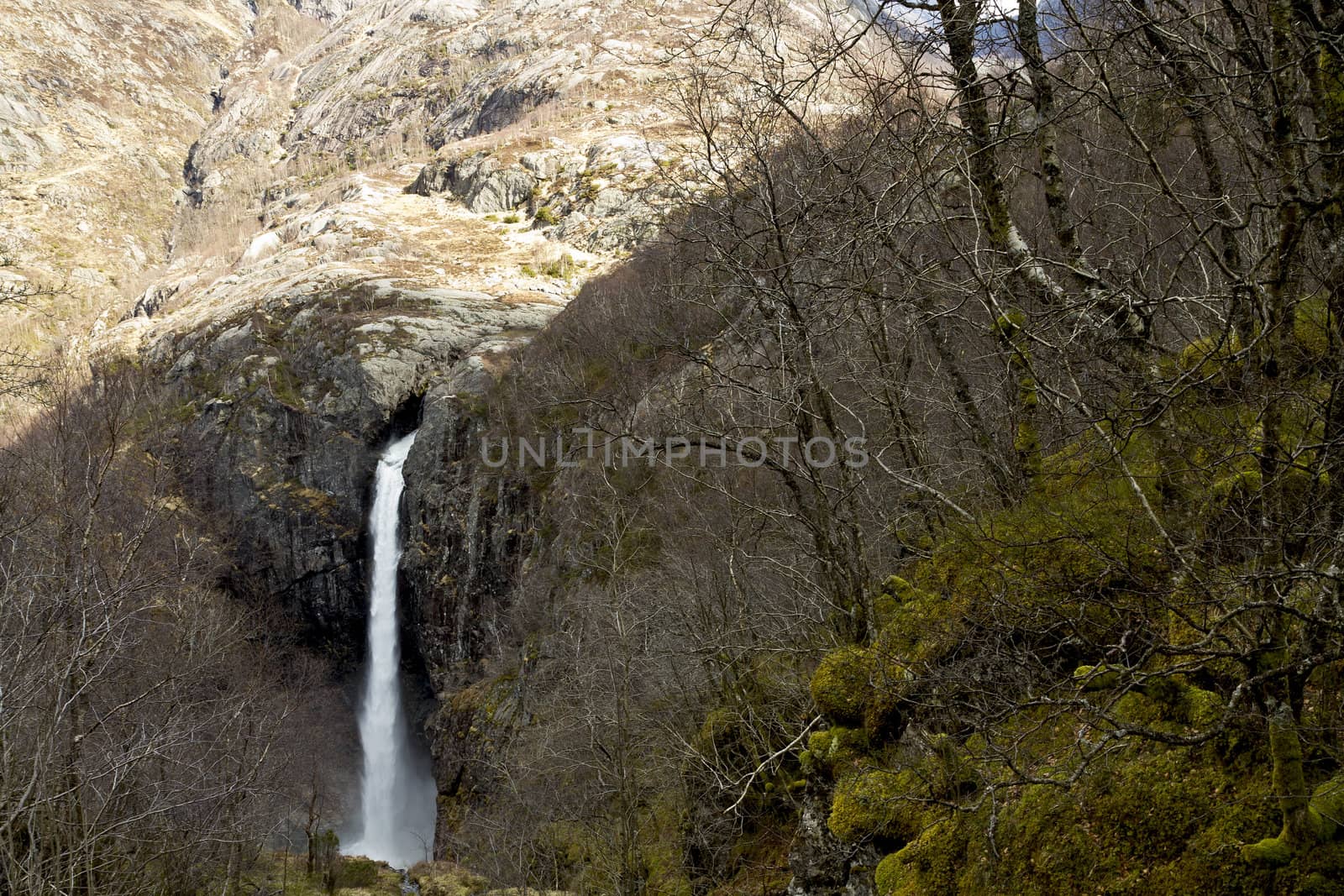 steep mountain with waterfall in norway, europe