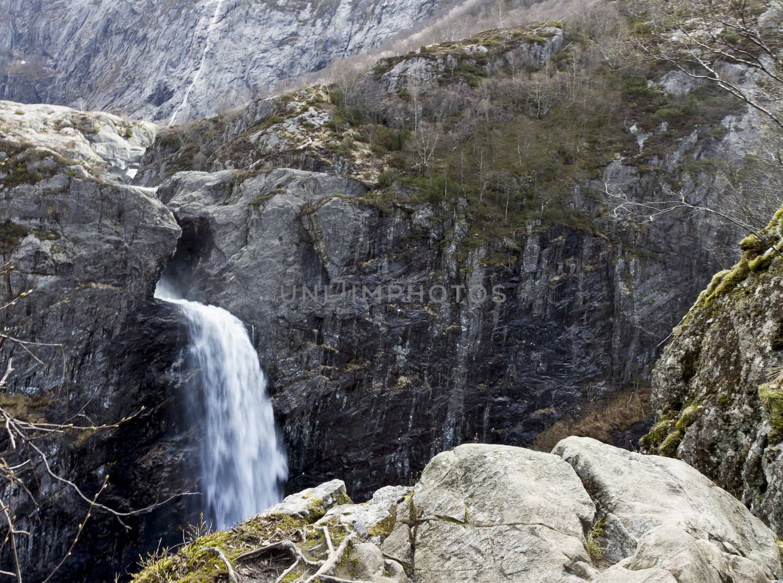 steep mountain with waterfall in norway, europe