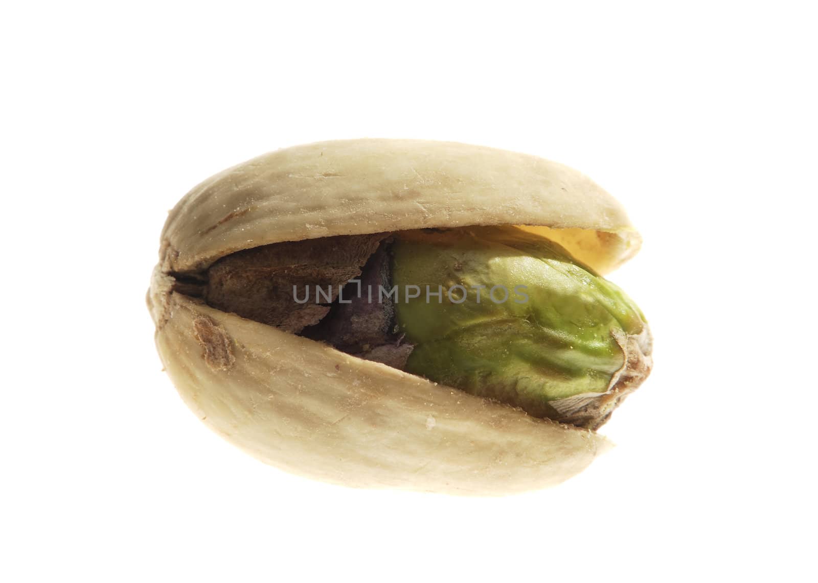 The pistachio nut closeup on white