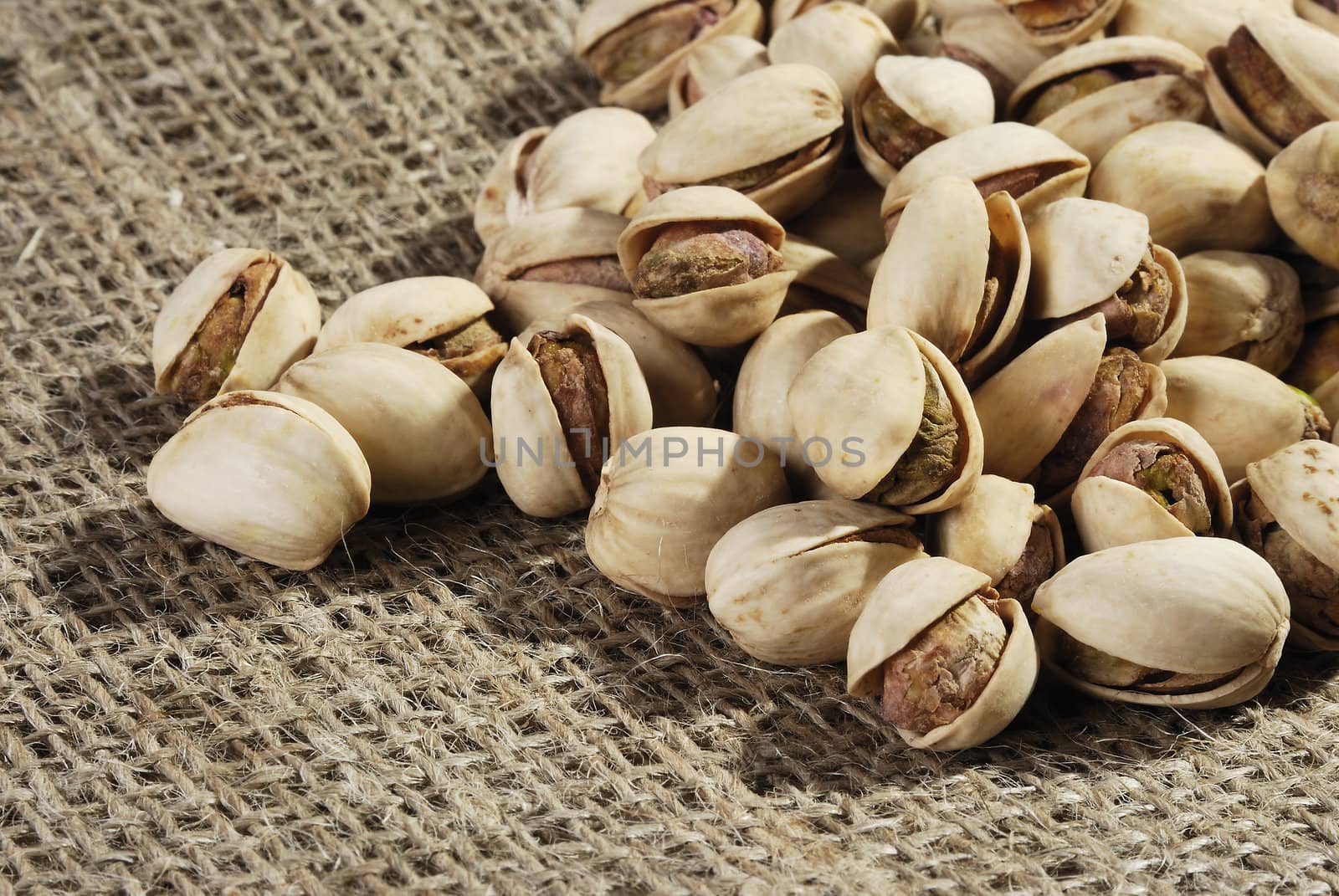 The pistachio nut closeup on jute