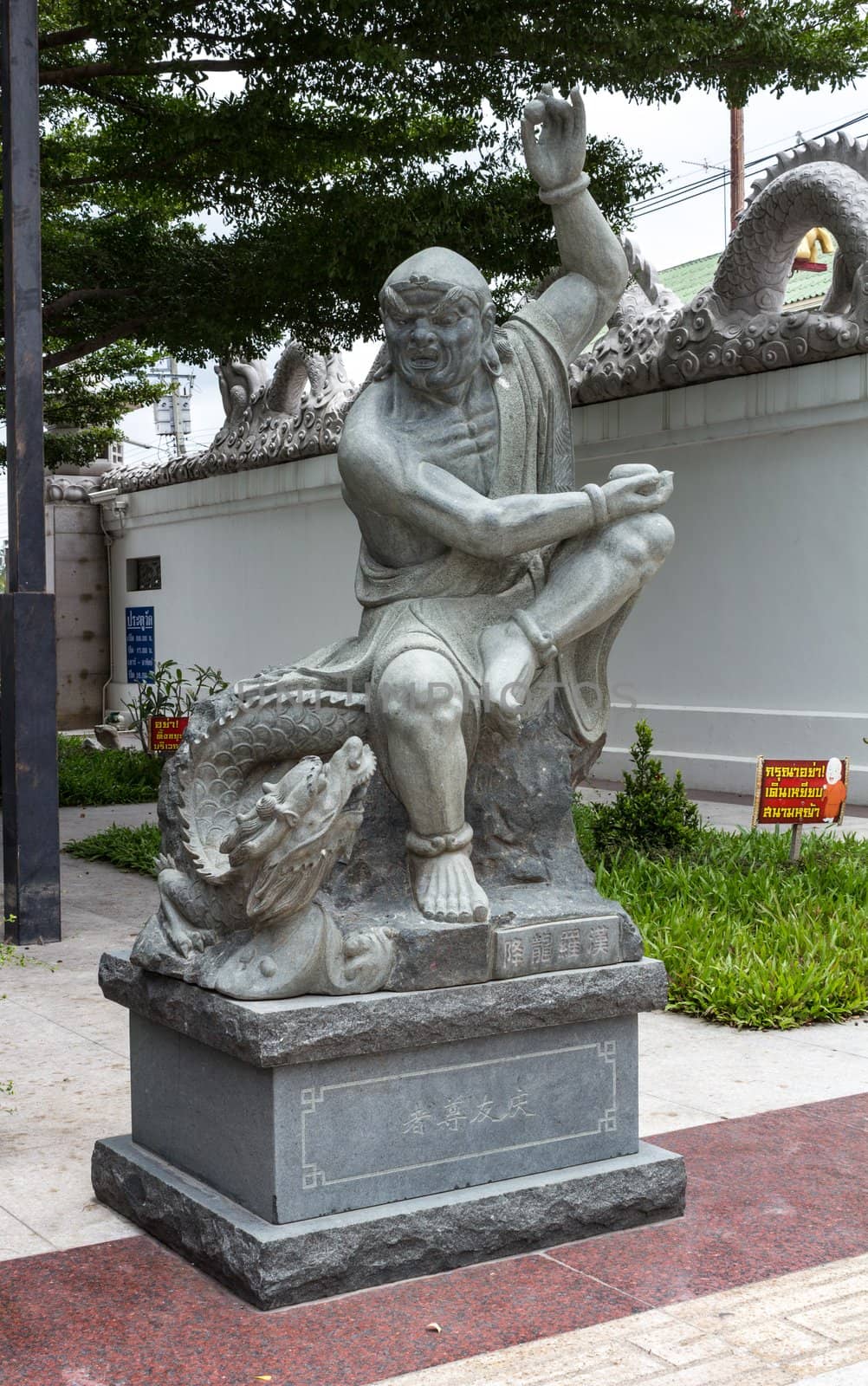 Statue of monk, chinese style, at Thai temple. Generality in Thailand, any kind of temple, art decorated in Buddhist church, temple etc. created with money donated by people to hire artist. They are public domain, no restrict in copy or use.This photo is taken under these conditions.