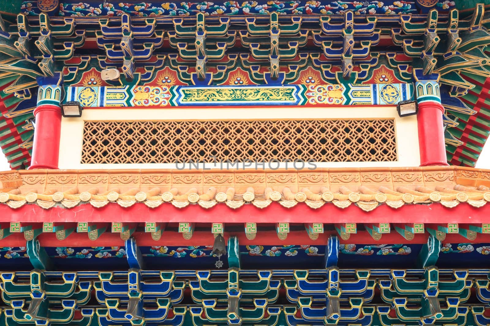 Eaves of Chinese temple, Thailand. Generality in Thailand, any kind of temple, art decorated in Buddhist church, temple etc. created with money donated by people to hire artist. They are public domain, no restrict in copy or use.This photo is taken under these conditions.