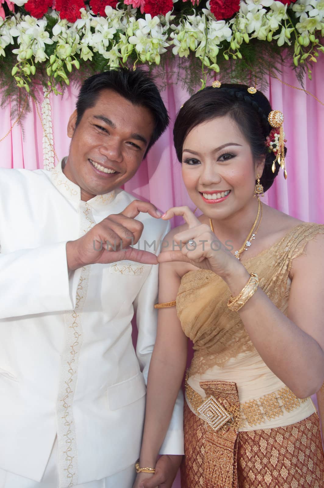 asian thai couple bride and bridegroom in thai wedding suit at wedding ceremony