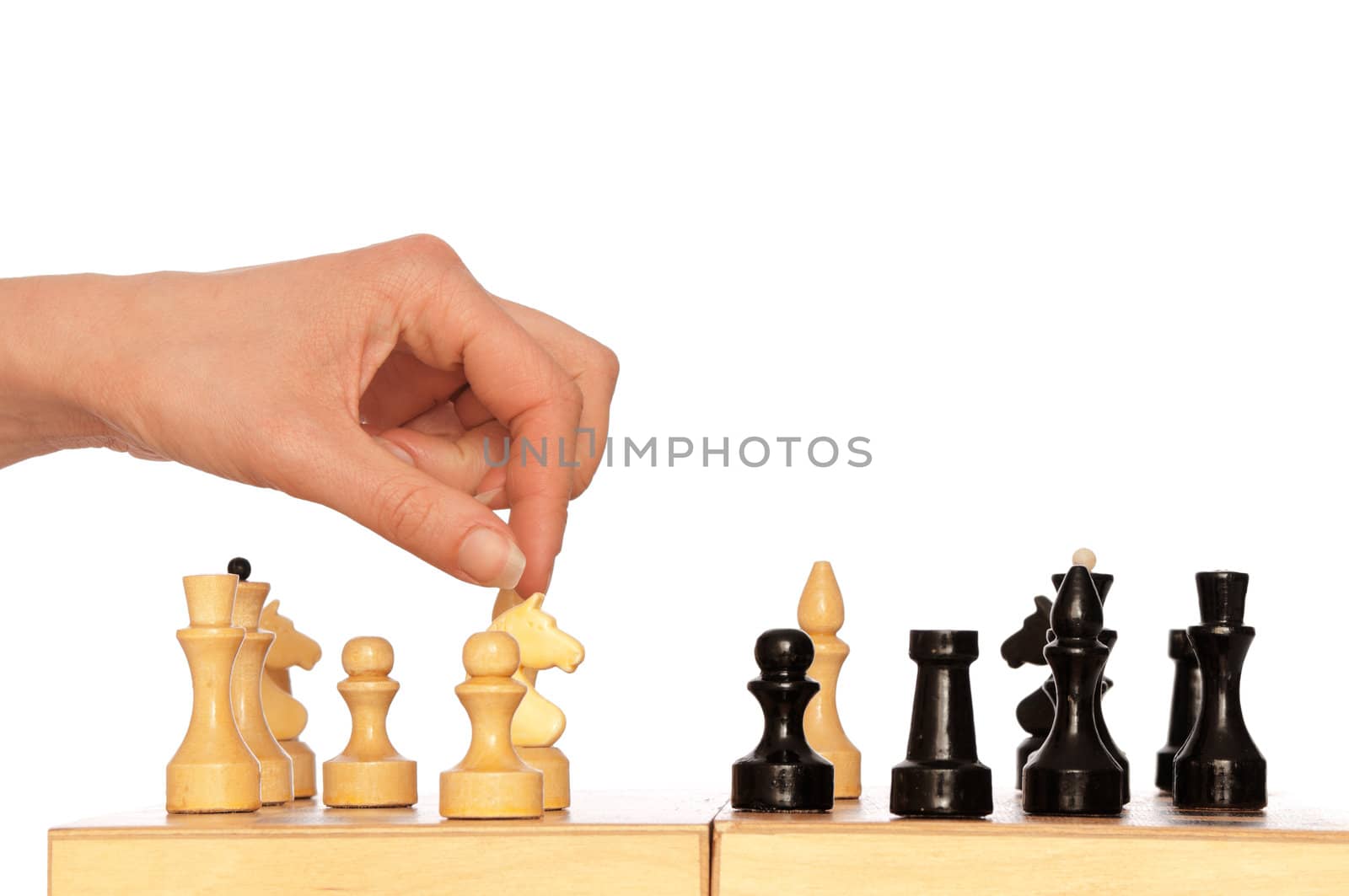 woman plays chess and chooses for victory next knight move