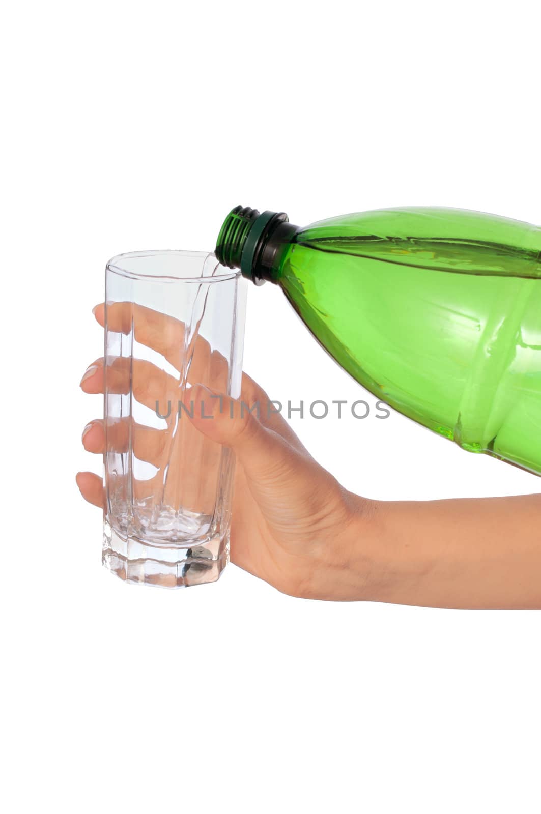 Woman pouring water to a glass from the bottle