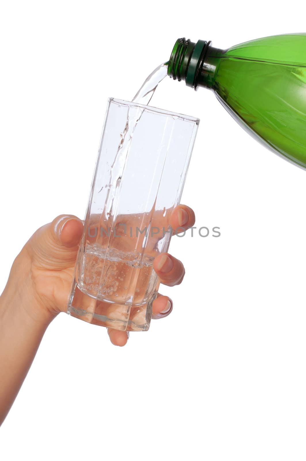 Woman pouring water to a glass from the bottle