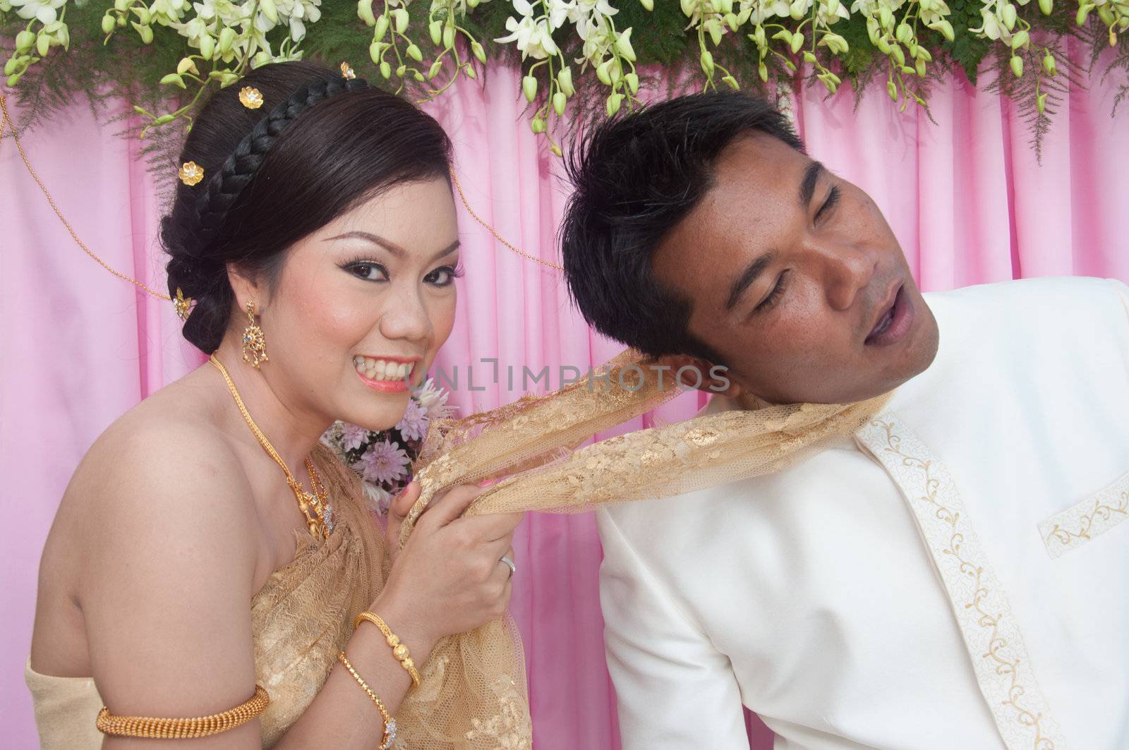 asian thai couple bride and bridegroom in thai wedding suit at wedding ceremony