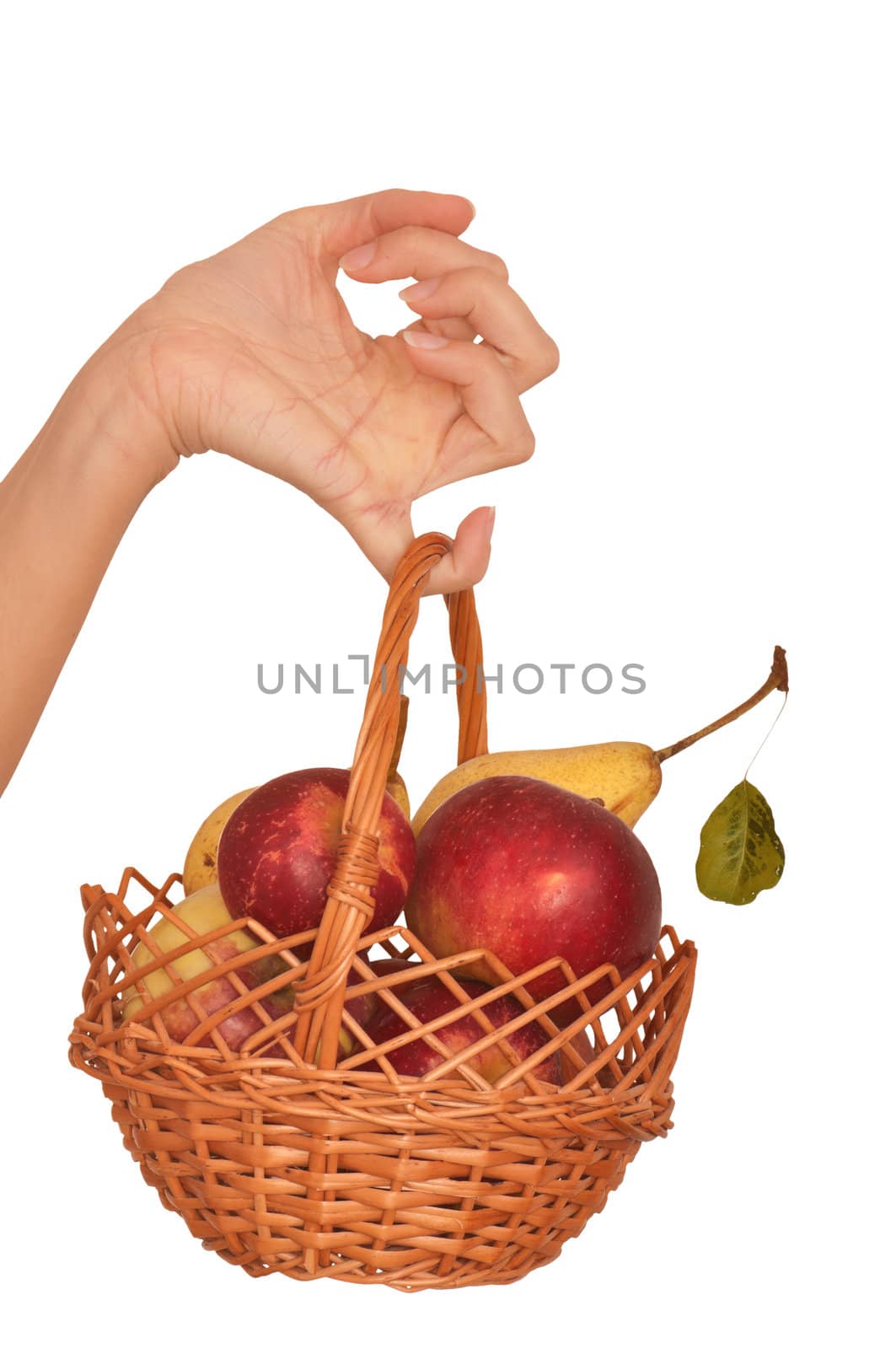 Basket with yellow pears and red apples from supermarket
