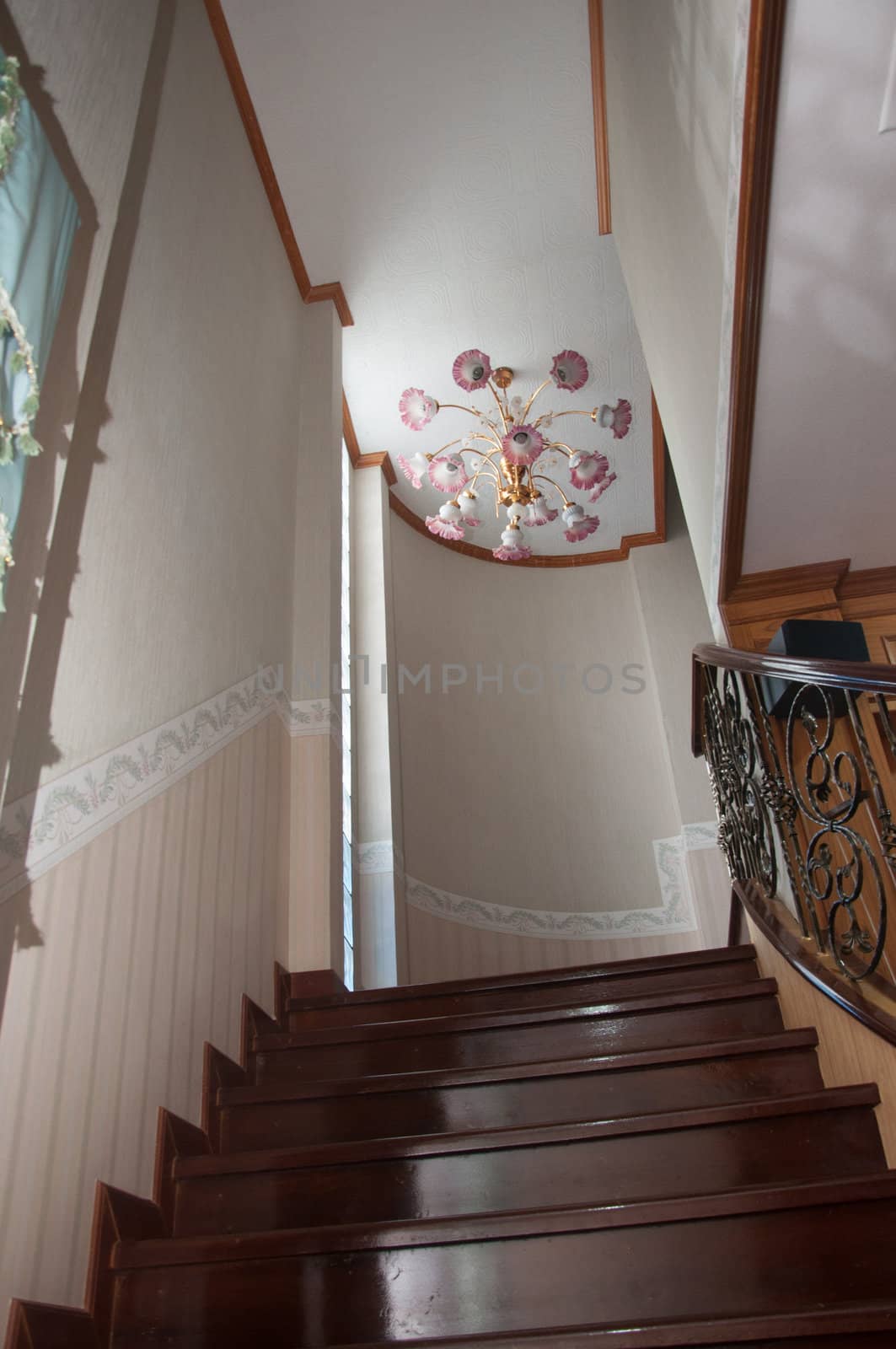 pink lamp decoration above the ladder to up stair by ngarare