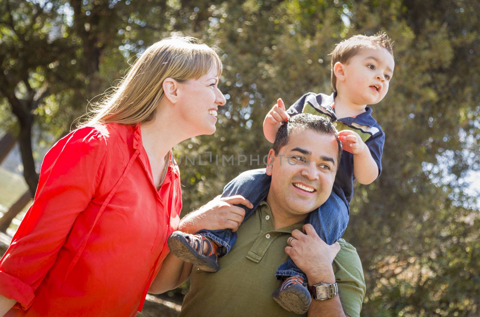 Happy Mixed Race Family with Enjoy a Walk in the Park.