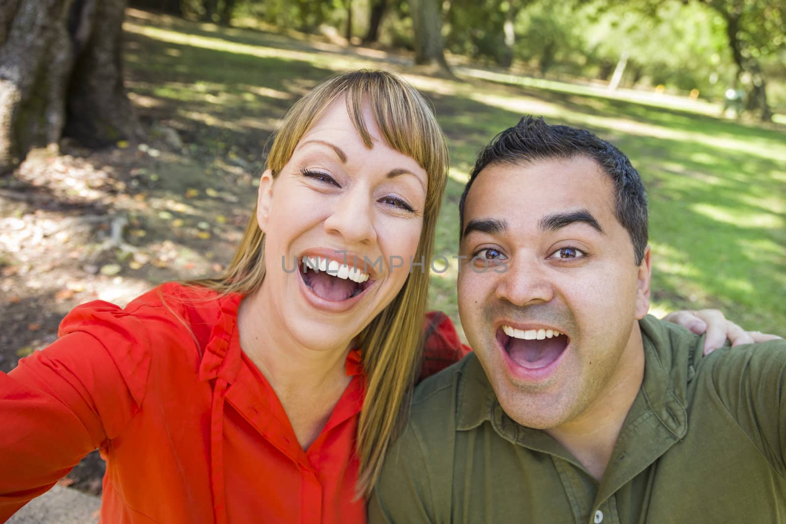 Happy Mixed Race Couple Self Portrait at the Park.