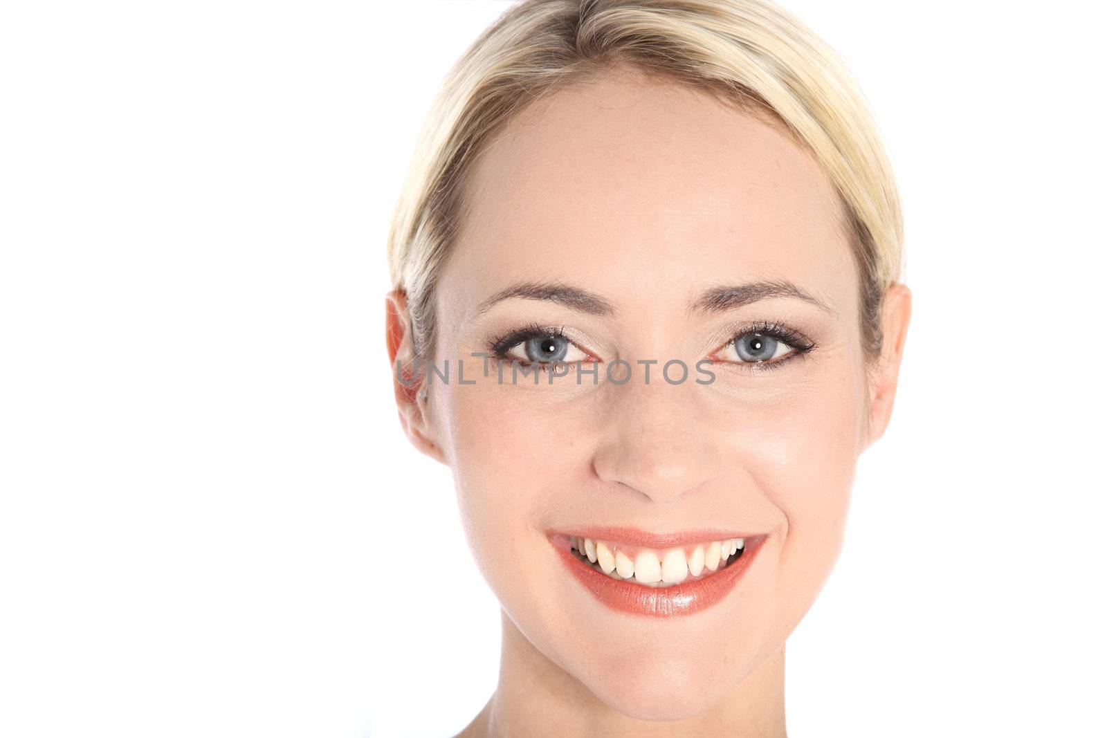 Close-up portrait of attractive smiling woman with blue eyes Close-up portrait of attractive smiling woman with blue eyes