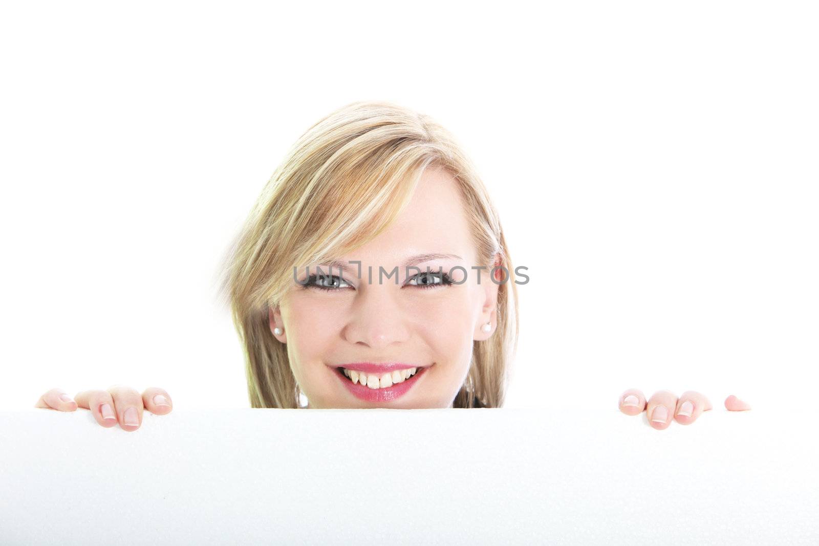 Studio shot of smiling blonde behind blank white board