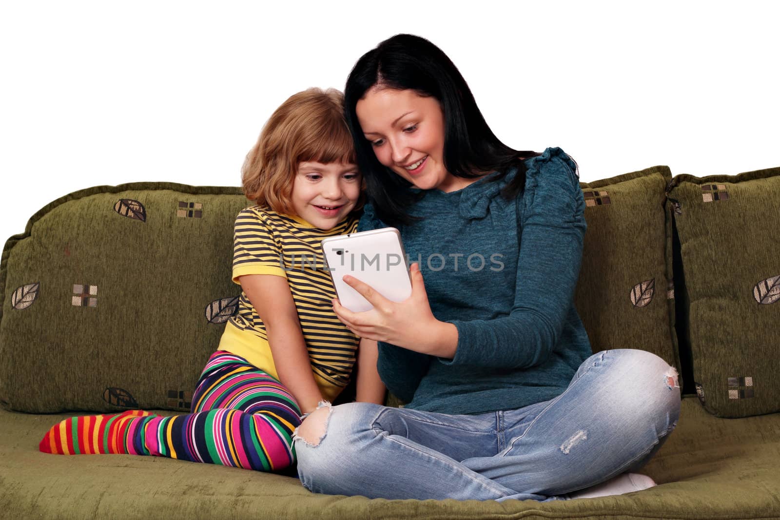 teenage and little girl playing with tablet pc by goce