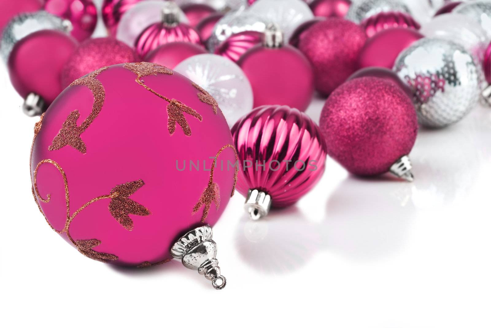 Pink christmas bauble ornaments on white by tish1