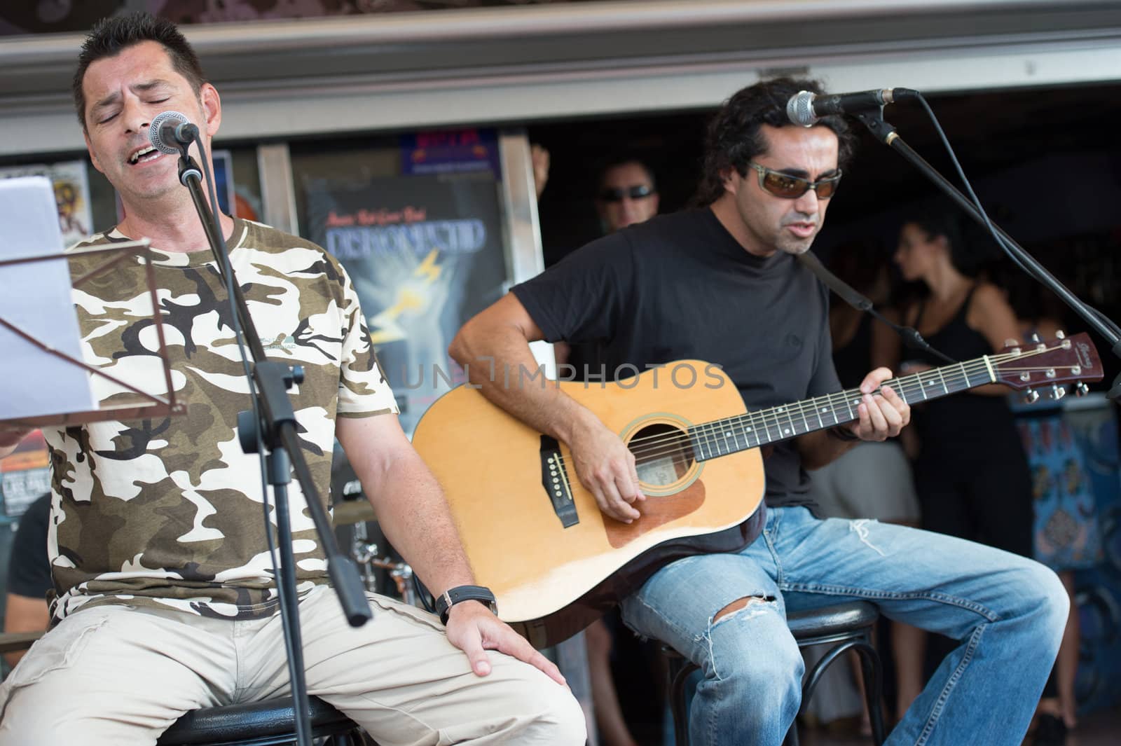 LAS PALMAS, SPAIN–SEPTEMBER 29, 2012: Singer Juanma Rodriguez (l) and guitarist Zack Monzon (r) playing in the new band Diskonectid, from Canary islands, during a concert at music bar La Guarida del Blues.
