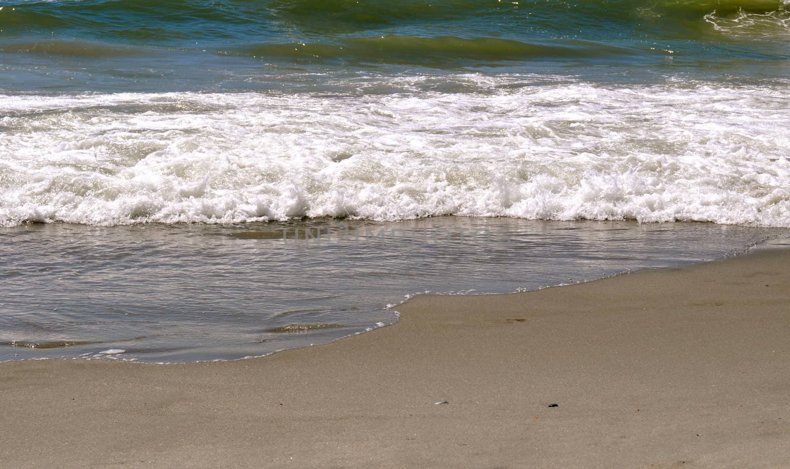 Sand and Waves by RefocusPhoto